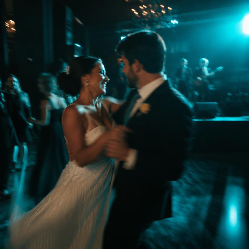 The couple dancing at an evening reception
